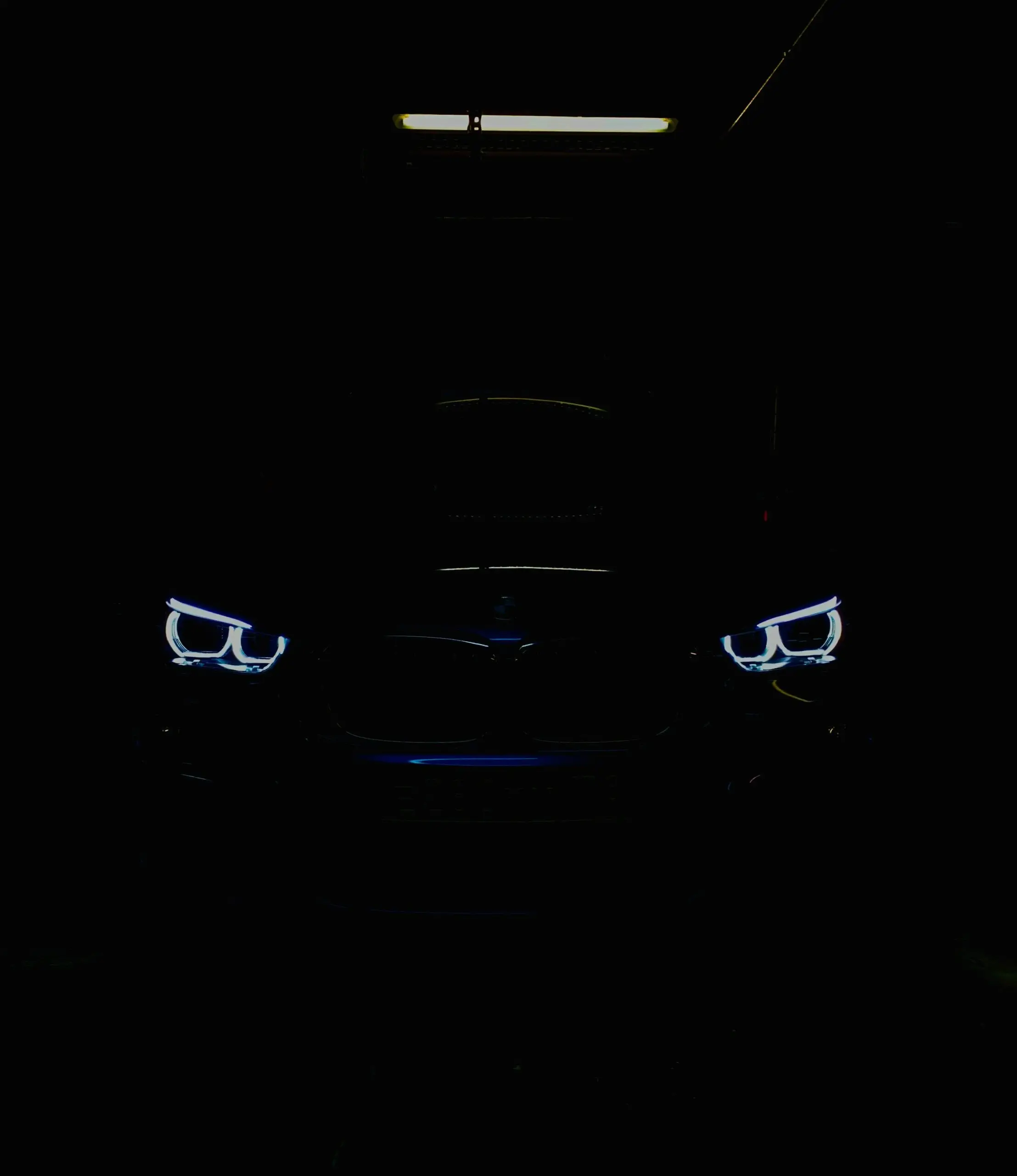 A car's headlights glowing in the dark